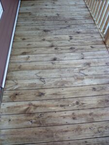 Those same floorboards (now towards the top of photo) look much better after cleaning and brightening with RAD.